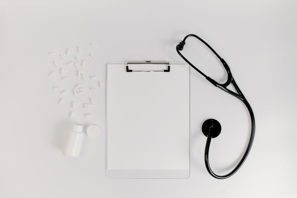 Doctor reviewing notes on a medical clipboard